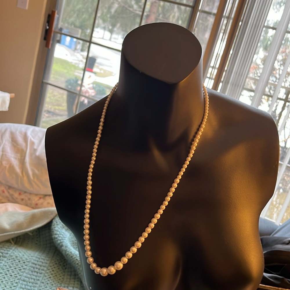 22 inch strand of faux pearls